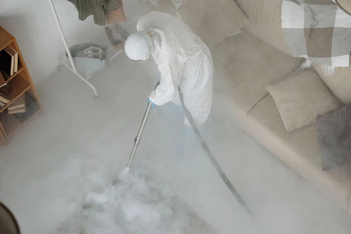 Biohazard cleanup technician in protective equipment, Butler Beach, FL